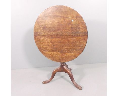 A 19th century mahogany circular tilt-top occasional table on turned column with tripod base. 75x68cm.