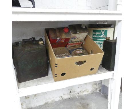 Eight various vintage petrol cans, including Esso, Mobil, BP, Amoco etc.