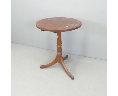 A 19th century mahogany circular tilt-top occasional table, on turned central column with tripod base. 54x73cm. Appears to ha