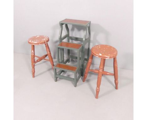 A vintage painted folding step-stool with leather panels, 35x72x53cm, and a pair of painted stools, height 51cm. (3)