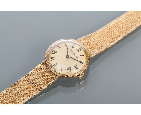 LADY'S TWENTIETH CENTURY NINE CARAT GOLD JAEGER-LECOULTRE WATCH
signed manual wind movement, the gilt dial with black Roman n