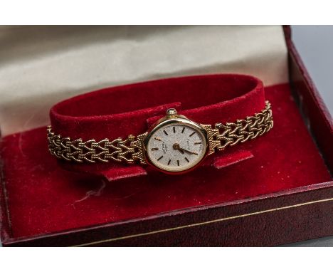 LADY'S TWENTIETH CENTURY NINE CARAT GOLD QUARTZ ROTARY COCKTAIL WATCH
quartz movement, the champagne dial with gilt baton hou