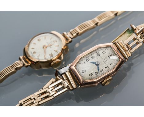 LADY'S NINE CARAT GOLD RECORD COCKTAIL WATCH
signed fifteen jewels manual wind movement, the signed dial with Arabic numeral 