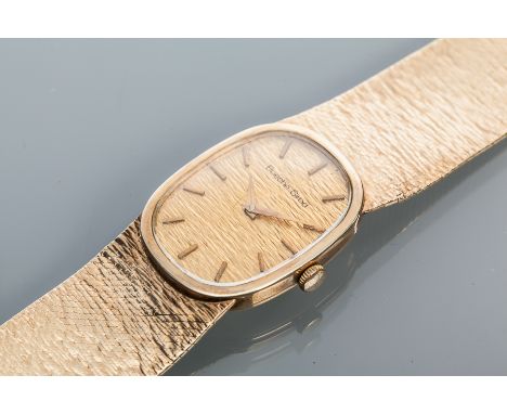 GENTLEMAN'S NINE CARAT GOLD BUECHE-GIROD WRISTWATCH WITH INTEGRAL STRAP
circa 1970s, signed seventeen jewels manual wind move