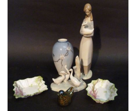 A Royal Copenhagen Porcelain Oviform Vase, together with a Nao porcelain group, another similar figure, two Royal Albert dish