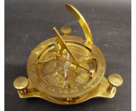 A Brass Compass with Sun Dial, bearing inscription West London, 9 cms diameter