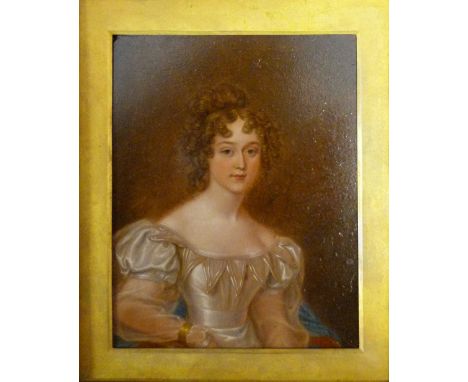 An Early 19th Century Portrait Miniature depicting a lady in period dress, oil on board within an ebonised frame, 14 x 11 cms