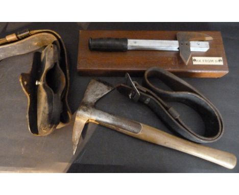 An Early Fire Service Axe, with leather belt together with another similar with rectangular oak mount