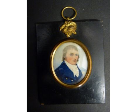 An Early 19th Century Portrait Miniature on Ivory depicting a gentleman in period dress within an ebonised frame with gilt mo