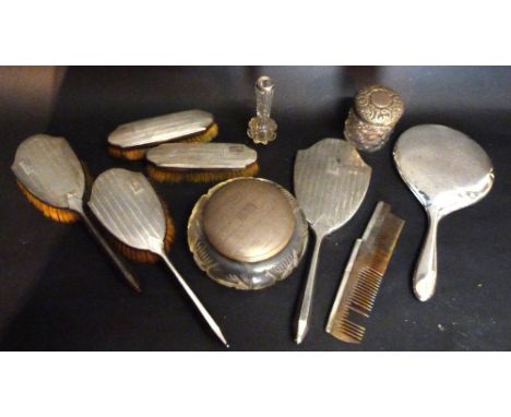 A Birmingham Silver Seven Piece Dressing Table Set, comprising four brushes, a hand mirror, a silver mounted comb and a silve