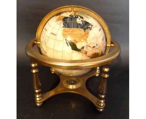 A Stone Set Globe of the World upon brass stand with compass, 30 cms diameter