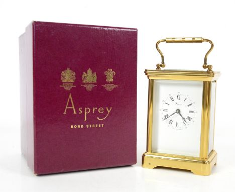 Brass carriage clock retailed by Asprey, the white enamel face with black roman numerals, 15cm, original boxCondition Report: