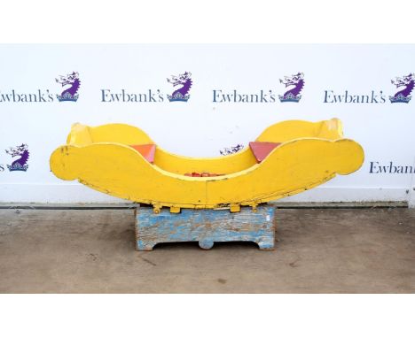 Vintage fairground boat shape swing seat, painted yellow and red, on a blue stand, seat H41, 141 x 41 cm