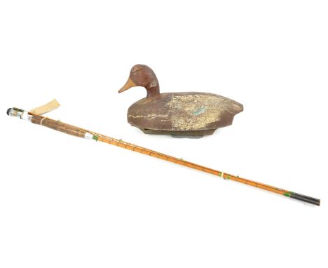 Carved and painted wood decoy duck with glass eyes and weighted base, 38cm together with a vintage split cane three piece fis