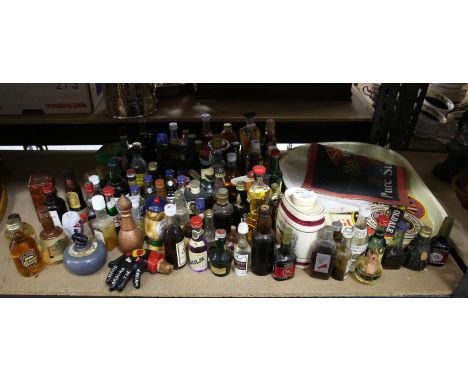 Collection on miniature spirits, including Beneagles Scotch Whisky in the form of a curling stone, other whisky, and other sp