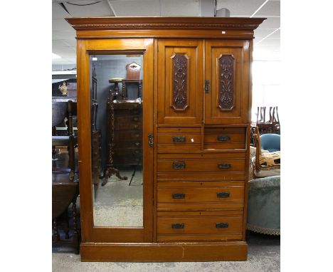 Early 20th century walnut wardrobe with mirrored door, panelled cupboard over two short and three long drawers on plinth base