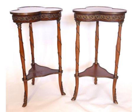 A pair of French inlaid mahogany lamp tables, having brass mounts with trefoil tops, raised on hoof feet, H.77 W.40 D.40cm 