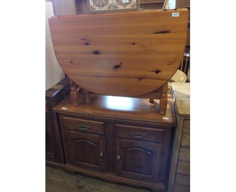 A pine gate leg table, a light oak two door, two drawer sideboard and two tile topped side tables