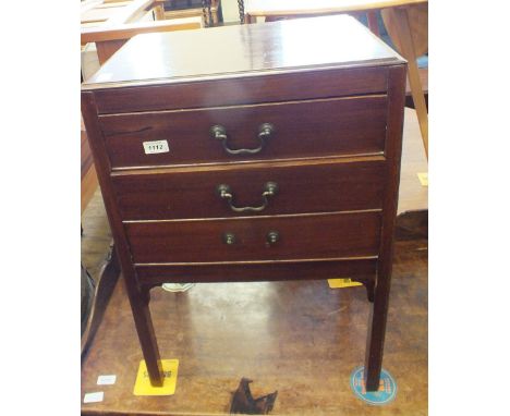 An Edwardian three drawer music cabinet with matching two drawer piano stool