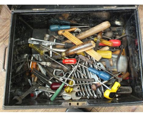 A small tin trunk containing a wide variety of tools