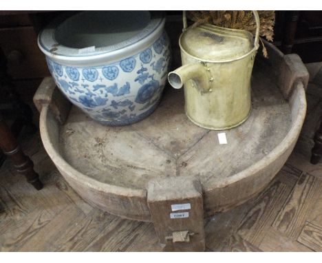 A circular wooden feeding trough, a ceramic jardiniere and vintage yellow painted watering can