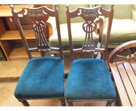 A set of four Art Nouveau mahogany dining chairs with upholstered seats