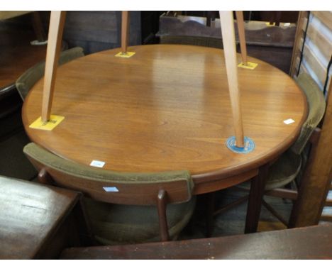 A vintage G Plan circular dining table and four chairs