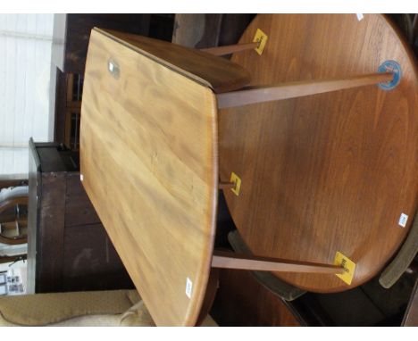 A light Ercol flap leaf kitchen table