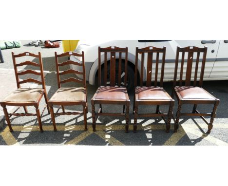 A selection of oak twentieth century chairs to include two ladder back dining chairs and three other leather topped dining ch
