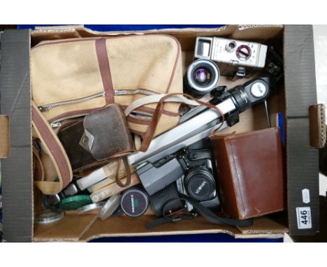 A mixed collection of vintage camera equipment including Minnolta X500 film camera, AGFA fold out camera, Bell and Howell 8mm