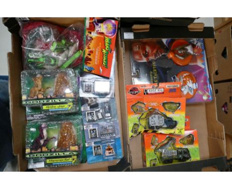 A collection of carded novelty toy items, includes mars attacks string light set, boxed Godzilla hammer tail, lost in space f