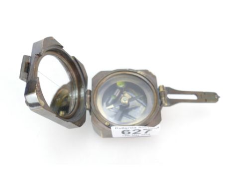 A Kevin & Hughes brass compass