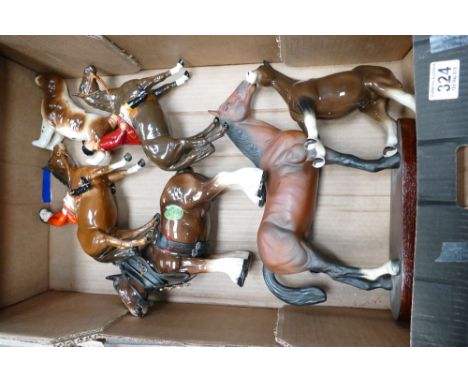 A collection of ceramic horses to include damaged Beswick Huntsman 1501, overpainted Beswick Huntsman 1501, Melbaware shire h