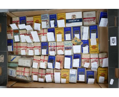 A collection of vintage cigarette card held within cigarette packaging includes themes of British birds, wild flowers, army b