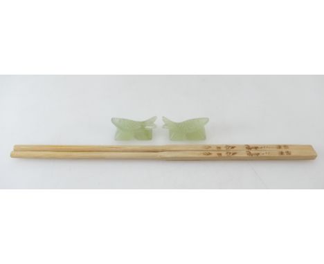 A pair of Chinese carved Jade chopstick rests.