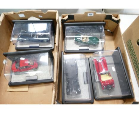 A collection of Franklin Mint Prestige die cast toy cars in display cases to include - 1961 Jaguar E-Type, 1930's Cadillac, 1