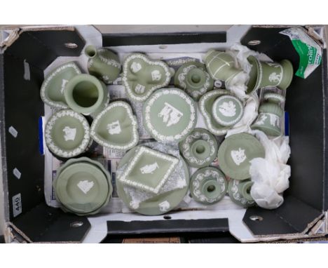A collection of Wedgwood jasperware sage green items to include candlesticks, ash trays, pin trays, sweet bowls, trinket boxe