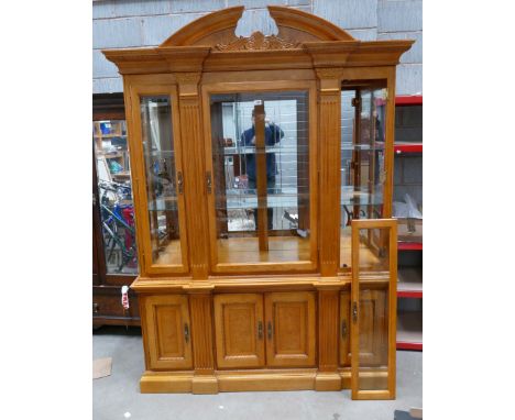 Quality reproduction light walnut Queen Anne style display unit, with glazed sides and three door glazed doors and mirrored i