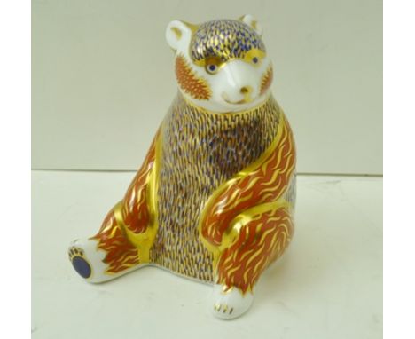 A ROYAL CROWN DERBY BONE CHINA PAPERWEIGHT, "Honey Bear", decorated and gilded in the Imari palette, with gold button, 10cm h