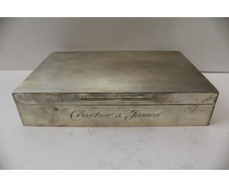 GARRARD AND CO. A SILVER CIGARETTE BOX, having engine turned hinged cover, sandalwood lined, London 1978, 21.5cm wide, engrav