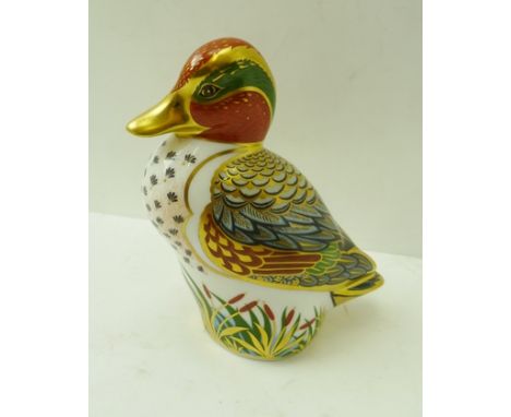 A ROYAL CROWN DERBY BONE CHINA PAPERWEIGHT, "Green Winged Teal", decorated and gilded in the Imari palette, with gold button,