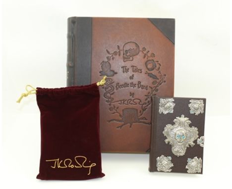 J.K. ROWLING "The Tales of Beedle the Bard", collector's edition, metal bound volume with clasp and skull, in a red velvet ba