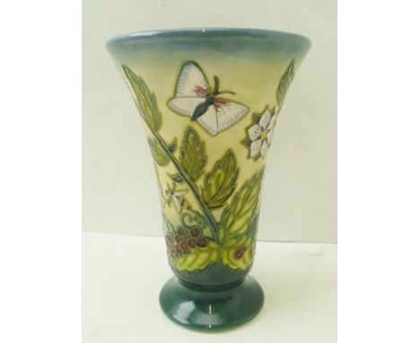 A MOORCROFT POTTERY VASE "Wild Strawberry" pattern, of flared trumpet form, tube lined and painted with plants and insects, i