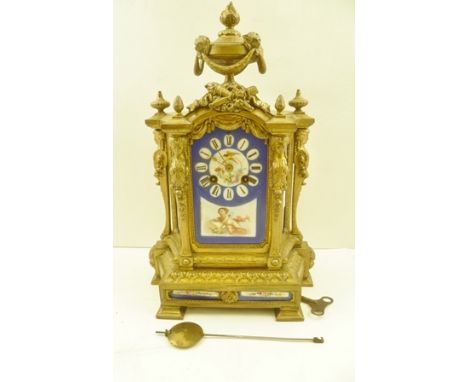 A 19TH CENTURY MANTEL CLOCK, gilded cast metal frame, inset painted porcelain panels in the Sevres style, mounted with a lion