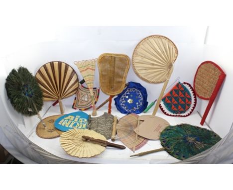 A COLLECTION OF INDIAN FANS (PANKHA) includes two peacock feather examples, an embossed white metal axe head, one from West B