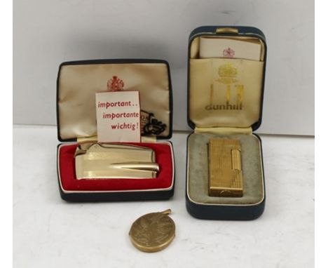 A 9CT GOLD OVAL PENDANT LOCKET, together with a DUNHILL and a RONSON LIGHTER (both boxed) 
