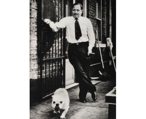 * Eisenstaedt (Alfred, 1898-1995). Portrait of Tennessee Williams with a bulldog by a yard door, circa 1950s, gelatin silver 