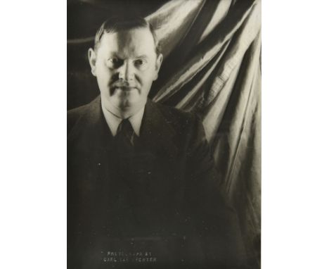 * Barnes (Julian, born 1946). Portrait of the author Julian Barnes standing in the doorway of a study by an unidentified phot