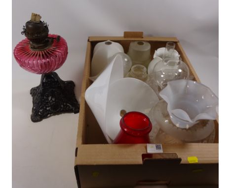 Victorian oil lamp with cranberry glass well and various vintage glass shades Condition Report Click here for further images,