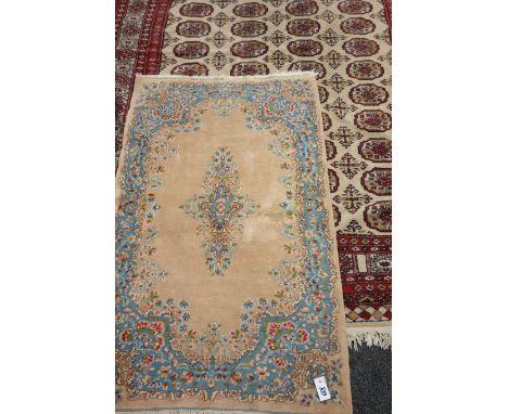 Afghan Bokhara design rug carpet and a small Kerman rug  Condition Report Click here for further images, condition, auction t